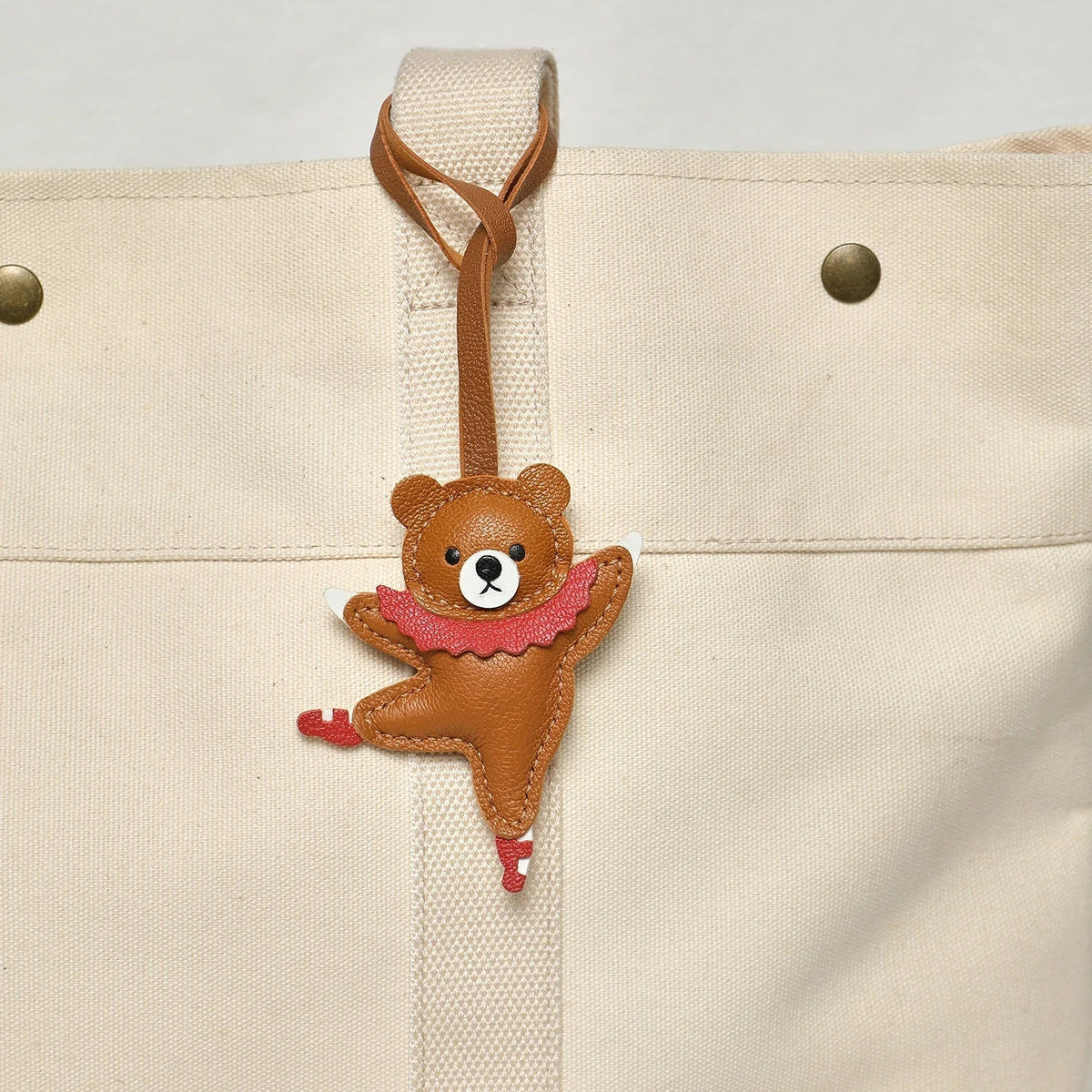 Breloque de sac et porte-clés en cuir noir sans visage