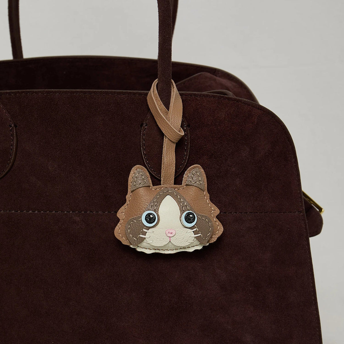 Breloque de sac et porte-clés en cuir noir sans visage