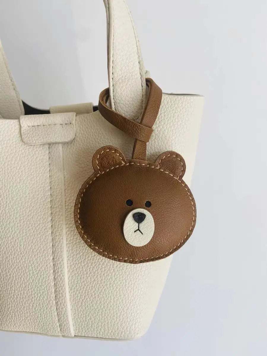 Breloque de sac et porte-clés en cuir noir sans visage