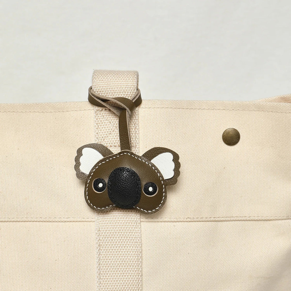 Breloque de sac et porte-clés en cuir noir sans visage