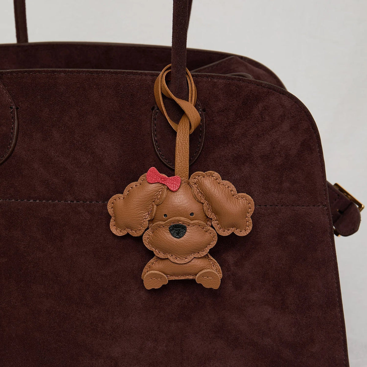 Breloque de sac et porte-clés en cuir noir sans visage