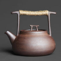 Théière en céramique avec chauffe-thé pour des moments de détente autour du thé à la maison