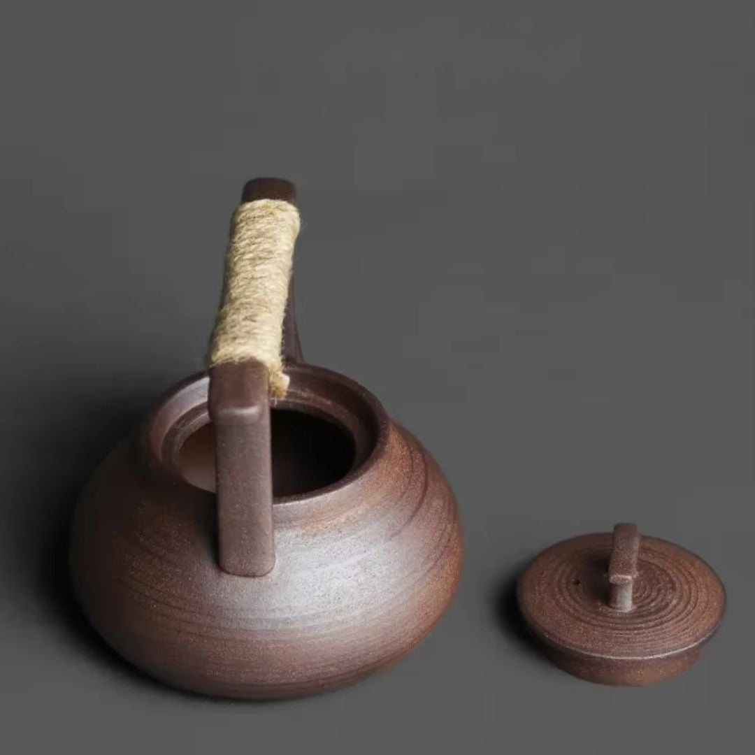 Théière en céramique avec chauffe-thé pour des moments de détente autour du thé à la maison