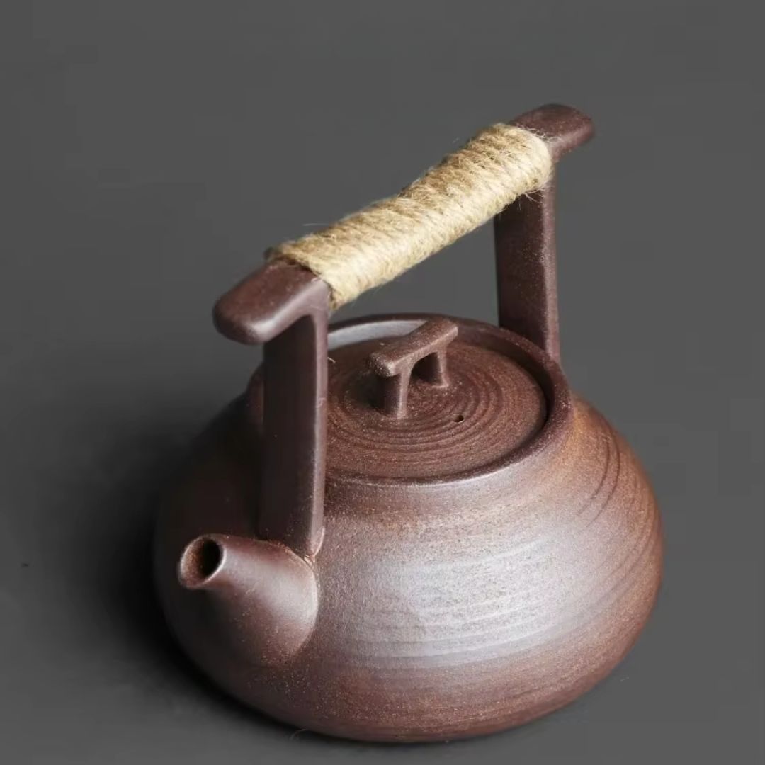 Théière en céramique avec chauffe-thé pour des moments de détente autour du thé à la maison
