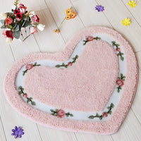 Alfombra de baño acolchada con flores en forma de corazón