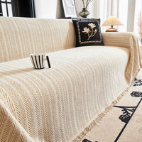 Housse de canapé en chenille à motif chevrons avec glands