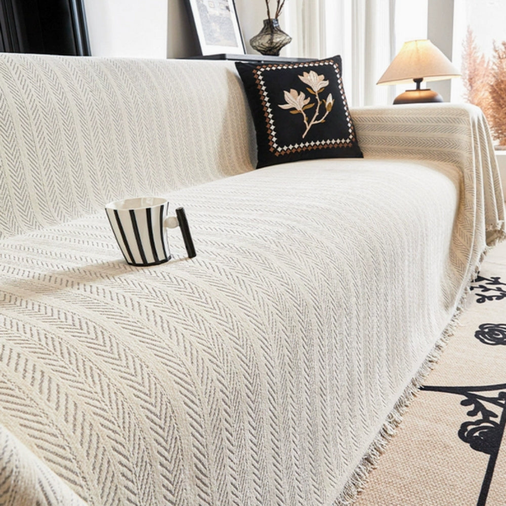 Housse de canapé en chenille à motif chevrons avec glands