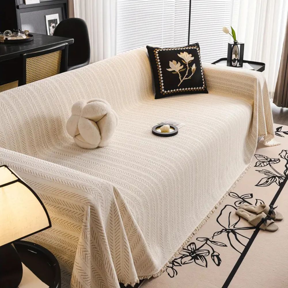 Housse de canapé en chenille à motif chevrons avec glands