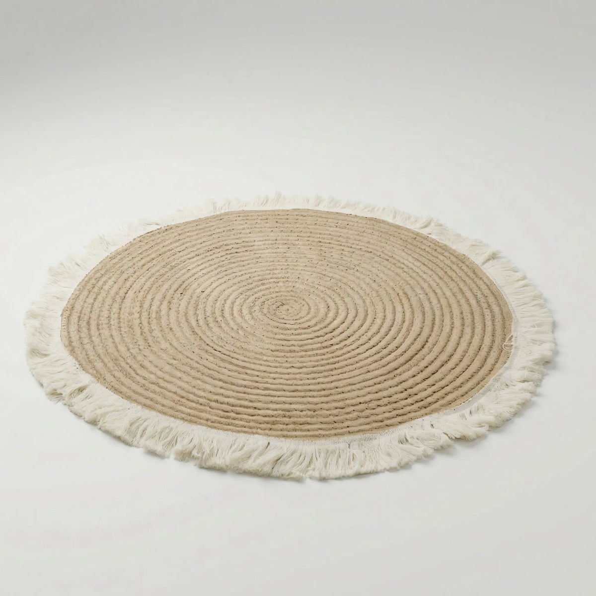 Tapis rond tressé à franges