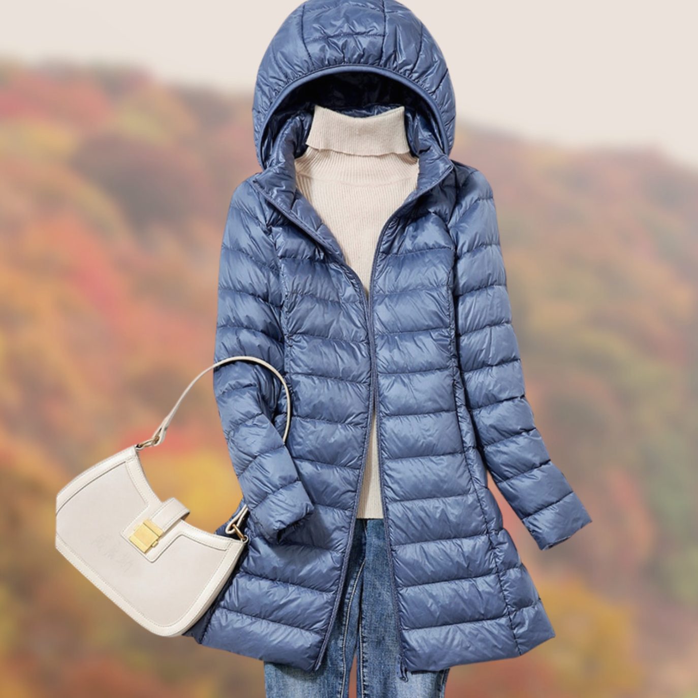 Veste longue matelassée à capuche et coupe ajustée pour femme